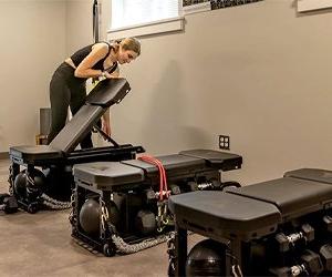 inside Stevenson and Vincent basement workout space with equipment